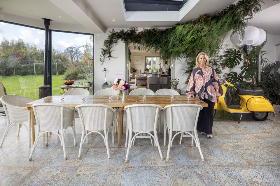 Events manager Bree Allen in one of the two conservatories which flank each end of the house; the kitchen/dining/living room is sandwiched between the two. Photo: Tony Gavin